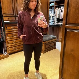 Nike fuzzy zip up jacket. Burgund/maroon in color.